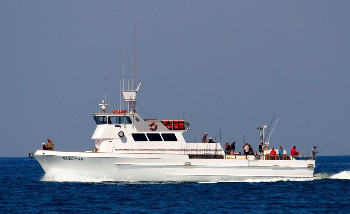 People enjoy catching fishing excursions on a commercial passenger fishing vessel. Credit: Photograph “Electra” by Bryce Bradford (CC BY-NC-ND 2.0 DEED) on Flickr.